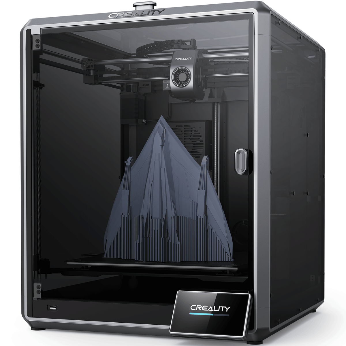 A black Creality K1 Max 3D Printer with a transparent side panel showing the interior structure and a printed object.