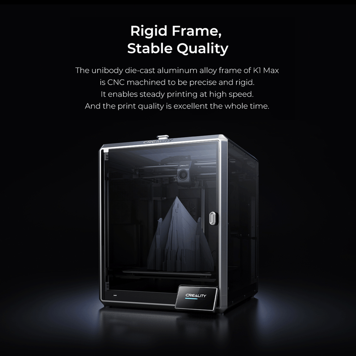 Creality K1 Max enclosed 3D printer highlighting its rigid unibody die-cast aluminum alloy frame. The image displays the sturdy, CNC-machined structure with a glass front door, a built-in touchscreen interface, and a large, intricate grey 3D printed model inside the chamber to demonstrate stable, high-speed print quality.
