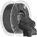 Spool of black 3D printing filament and a small dog figurine on a white background