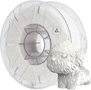 A spool of translucent white 3D printing filament shown next to a small white dog figurine on a plain white background.