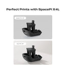 Two 3D-printed models of a ship, one labeled 'Moist PA-CF' and the other 'Dry PA-CF', with text 'Perfect Prints with SpacePi X4L' above.