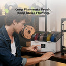 Person interacting with a 3D printer filament storage device with text 'Keep Filaments Fresh, Keep Ideas Flowing.'