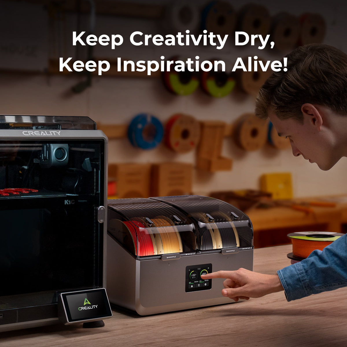 Person interacting with a 3D printing filament dryer with text 'Keep Creativity Dry, Keep Inspiration Alive!' in a workshop setting.